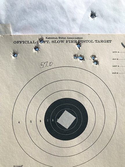 The third target, puffy variable wind at 8:00 with the 57-grain load. The high shot was compliments of the shooter.